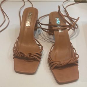 Sandals that tie up leg worn once for a wedding size 5